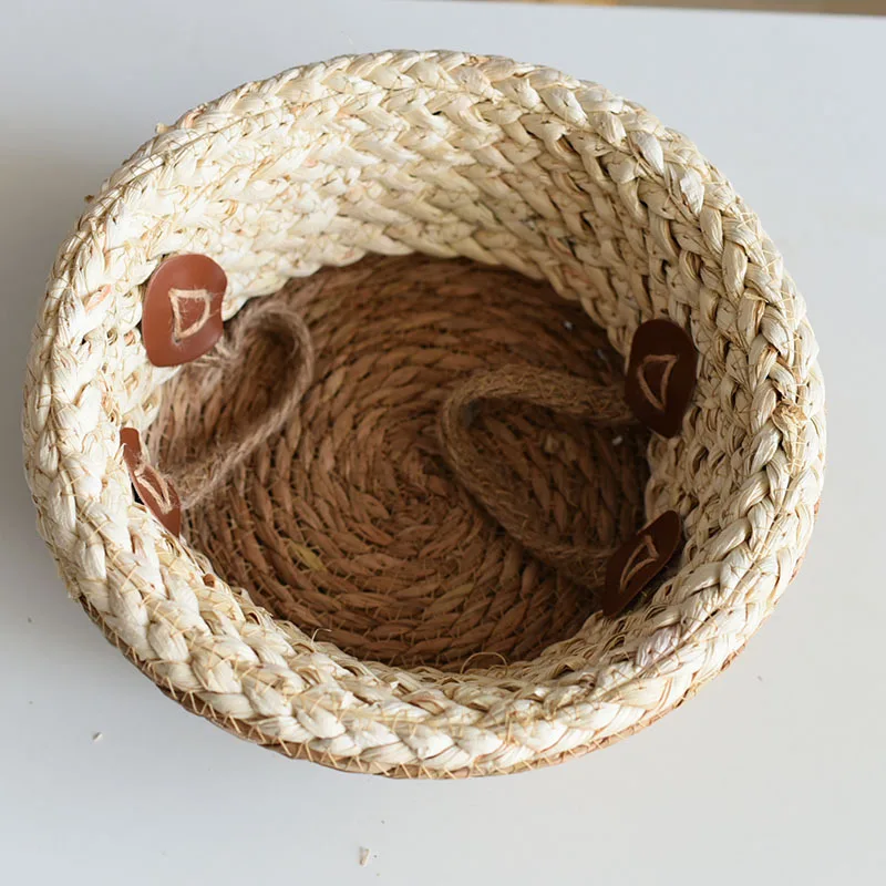 Natural woven seagrass basket showcasing textural details perfect for room corners